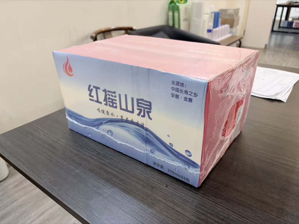 Carton wrapped in clear shrink film